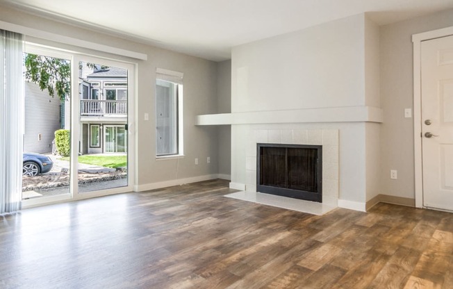 Novela Apartment Homes Living Room Fireplace and Patio Door