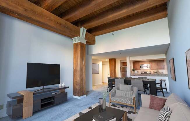 a living room with a couch and a tv at Lowertown Commons Apartments, Minnesota, 55101