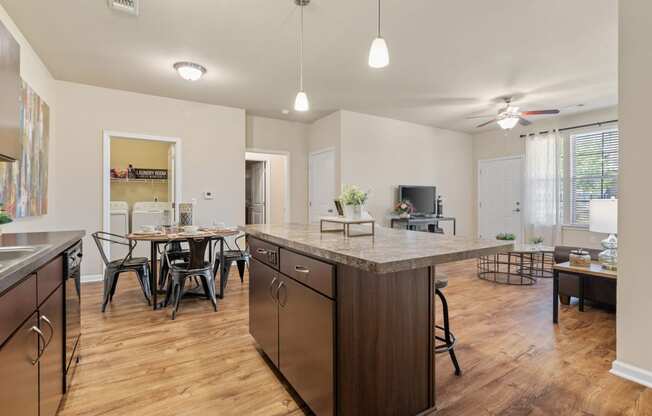 Expansive Kitchen Island with Overhead Lighting
