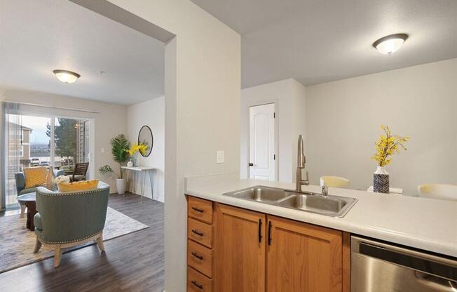 The Crossings at Chapel Hill Kitchen with Dishwasher and View into Living Room