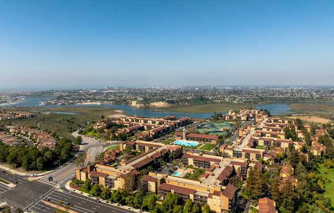 an aerial view of a city with buildings and a river