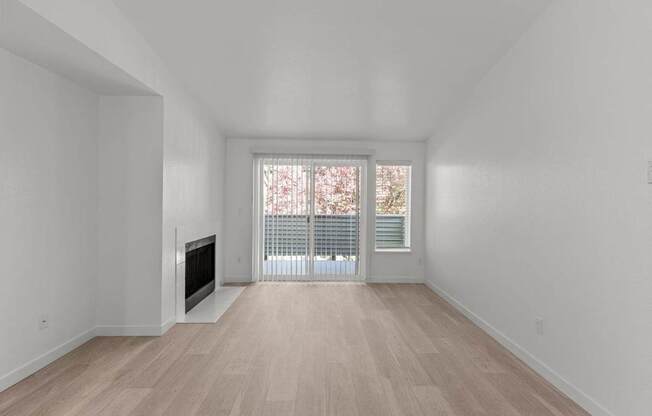 The Marina at Martha Lake Apartments in Bothell, WA Living Room with Fireplace and Private Patio