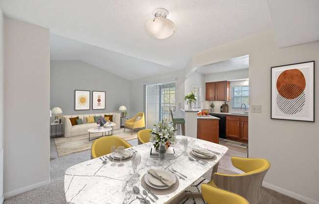 a living room and dining room with a marble table and chairs