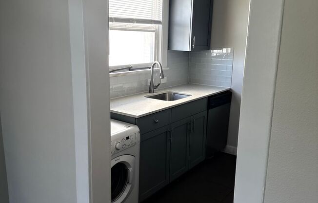 Great Location with Full Washer and Dryer in Unit and Full Kitchen!