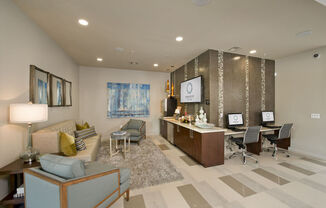 a lobby with a reception desk and a couch