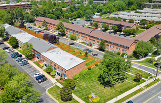 an aerial view of a large building in the middle of a street
