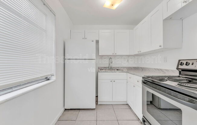 447 NE 125 ST