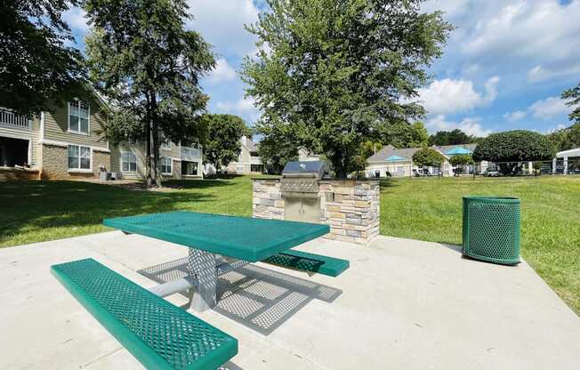 Picnic area with a picnic table and a fire pit at The Chase, Burlington North Carolina