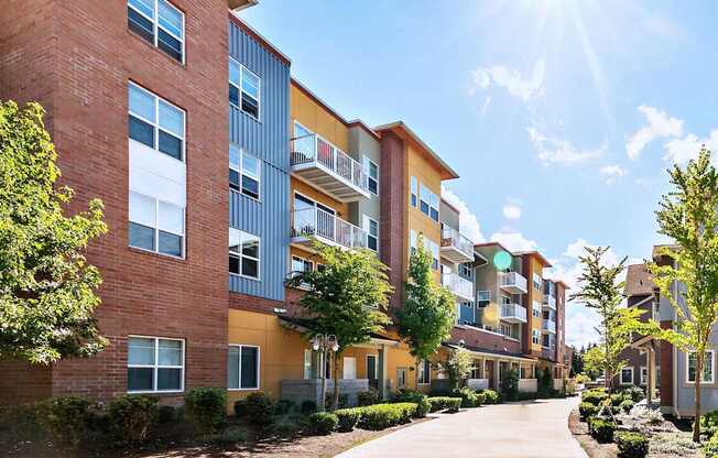 A sunny day at a residential building with a clear blue sky.