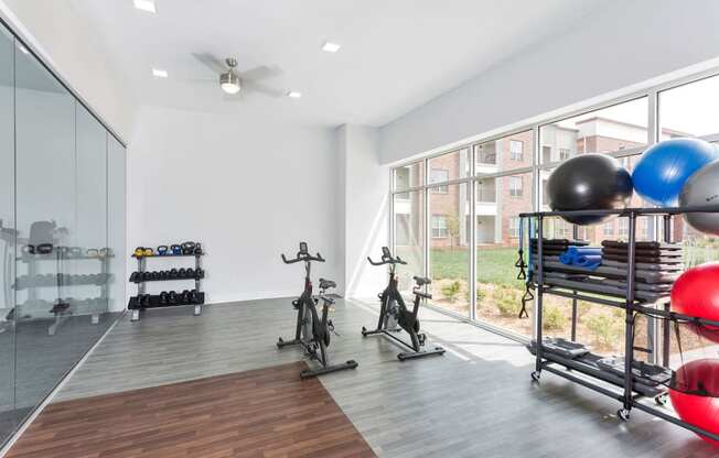 Westwood Green Apartments Wellness Room with spin bikes, and free weights