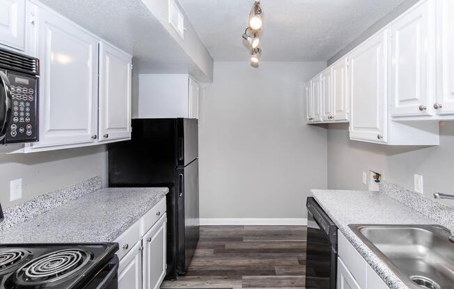 a stove top oven sitting inside of a kitchen