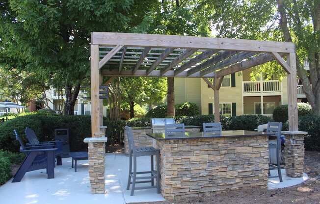 Poolside grill, lounge, and pergola at Stillwater at Grandview Cove