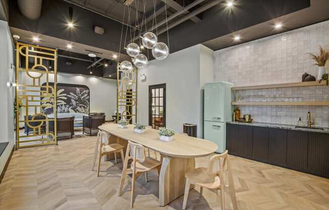 a dining room and kitchen with a large table and chairs