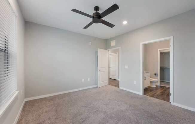 Bedroom with ceiling fan at AxisOne, Stuart, 34994