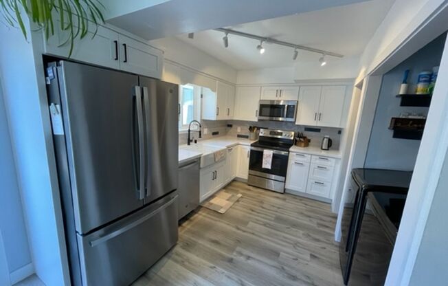 Rent Special - 2 weeks free rent!!! remodeled 4 bedroom, 2 story townhome in the heart of Huntington Beach.