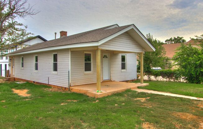 Stylishly Remodeled 2-Bedroom Home with Spacious Fenced Backyard and Gorgeous Green Kitchen Cabinets!