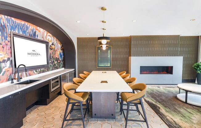 Whether you’re hosting, collaborating, or catching the game, this vibrant clubroom with a kitchen, fireplace, and plenty of seating sets the perfect scene.