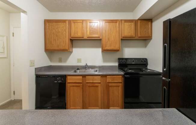 This is a photo of the kitchen of the 902 square foot, 2 bedroom, 1 and a half bath apartment at Blue Grass Manor Apartments in Erlanger, KY.