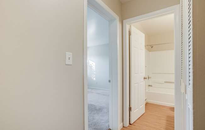 a bedroom with a closet and an open door