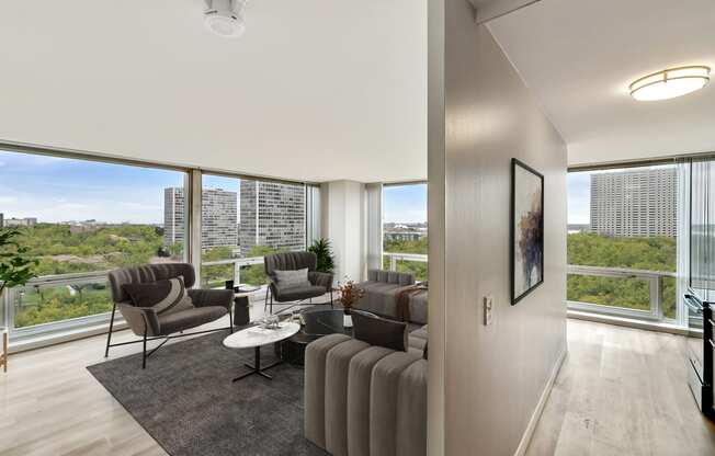 a living room with a large window and a view of the city