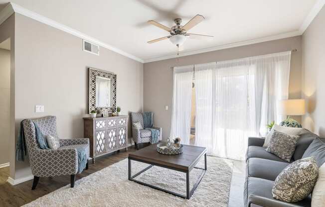 a living room with a ceiling fan