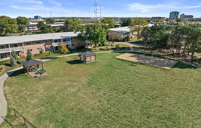 a park with a basketball court and a gazebo