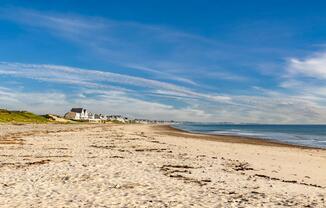 Rexhame Beach offers serene shoreline views just moments from Modera South Shore—your coastal escape is always close.