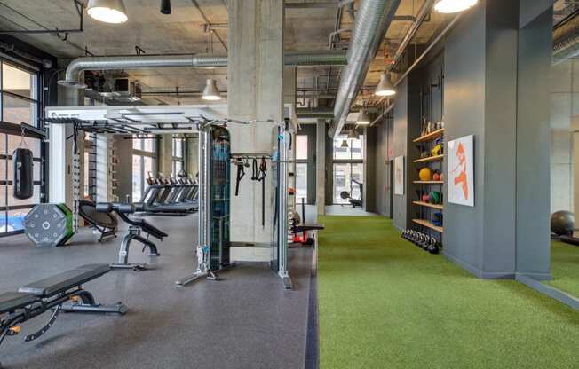 a gym with a bunch of exercise equipment in it