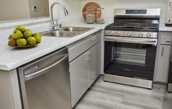 a stove top oven sitting inside of a kitchen