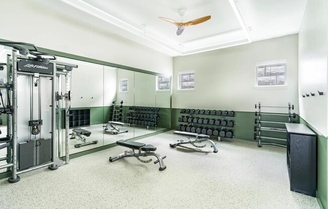 Stretch, lift, and focus on your form in this strength-training space outfitted with benches, free weights, and floor-to-ceiling mirrors.