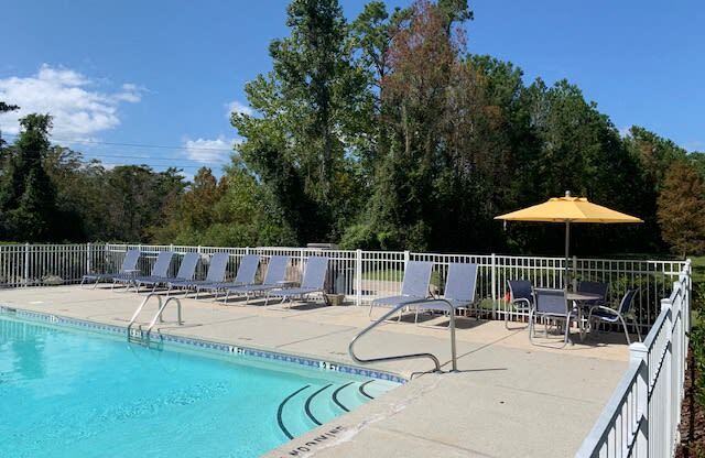 Sparkling swimming pool at Deerbrook Apartments in Wilmington, NC 28405