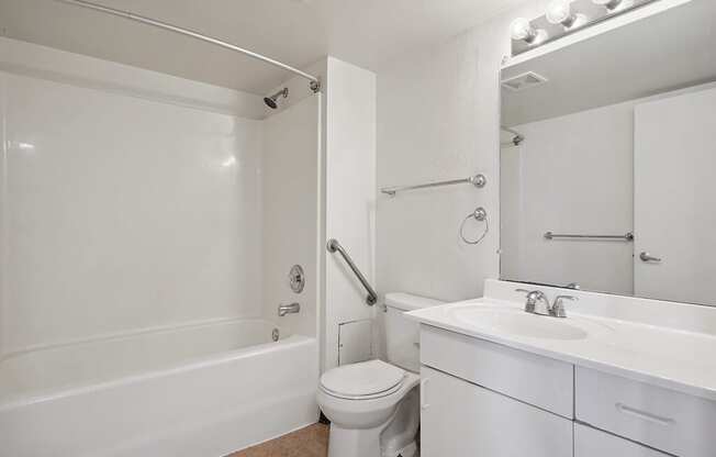 a bathroom with a sink toilet and a bath tub