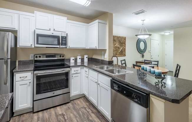The Colony at Deerwood Apartments - Open kitchens with stainless steel appliances