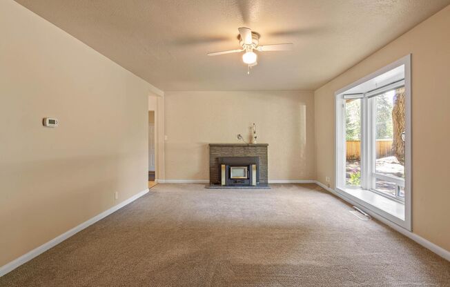 Charming, retro 2-bdrm/2-bath ranch w/ large family room in tranquil setting