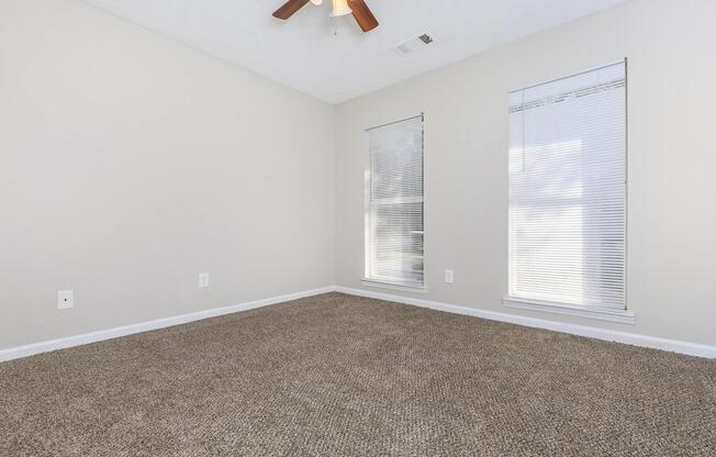 a bedroom with a large window