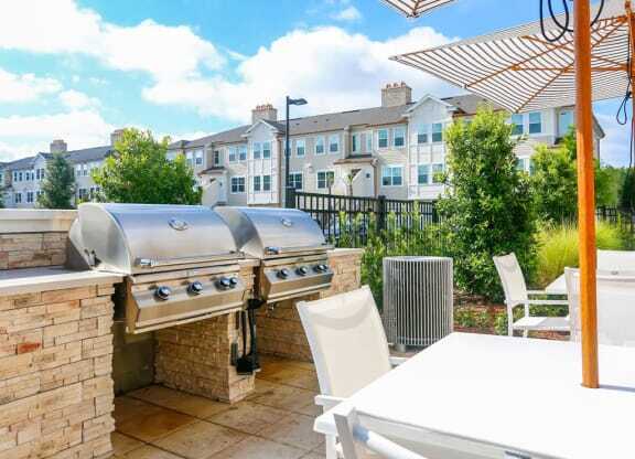 Outdoor entertaining zone complete with BBQ grills at Oasis Shingle Creek in Kissimmee, FL