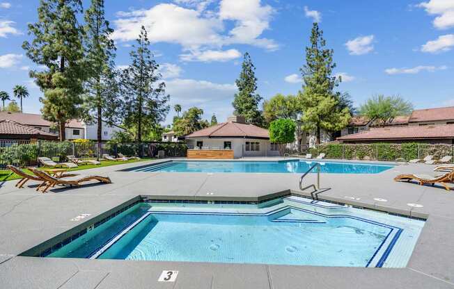A swimming pool with a slide in the middle of it.