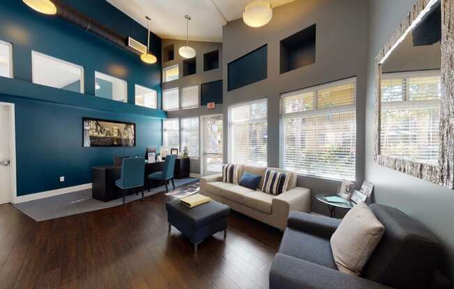 Leasing Office and Clubhouse with White Armchairs on Area Rug with Coffee Tables at The Marquee Apartments, North Hollywood, 91605