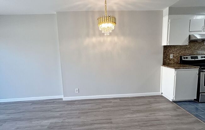 Move-in ready Evergreen townhome with private backyard, detached 2-car garage, and great community amenities