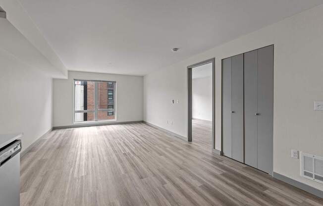 A room with wooden floors and white walls.