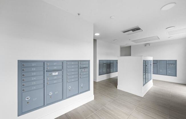 The locker room at the front of a building with blue lockers