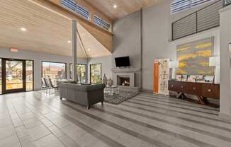 A modern living room with a fireplace and a television.