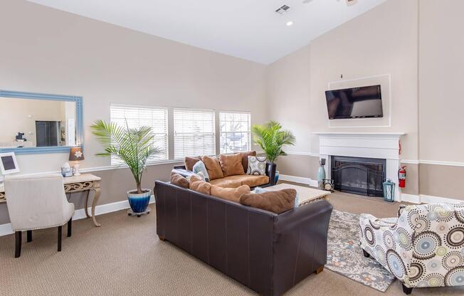 a living room filled with furniture and a fireplace