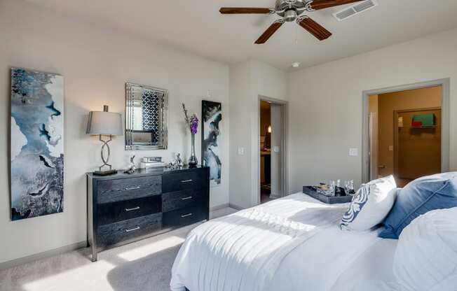 Carpeted Bedroom With Ceiling Fan & Light