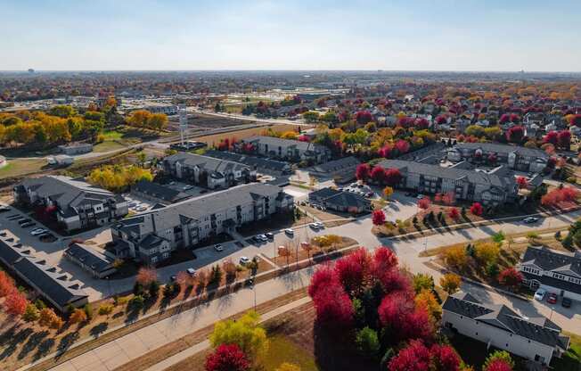 A view of a residential area with houses and trees.