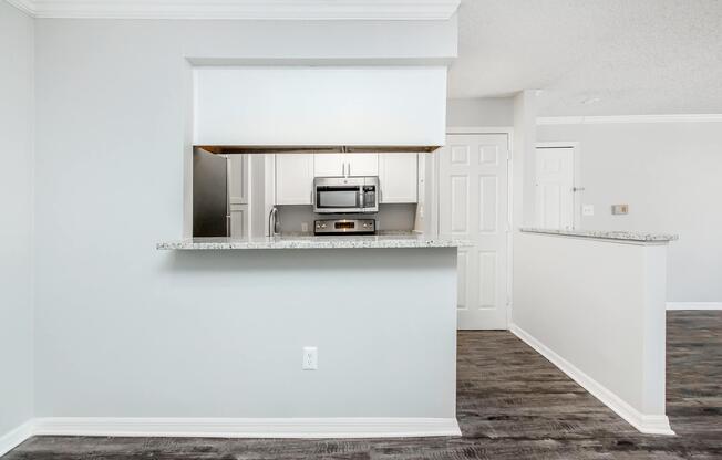 a kitchen with a sink and a refrigerator