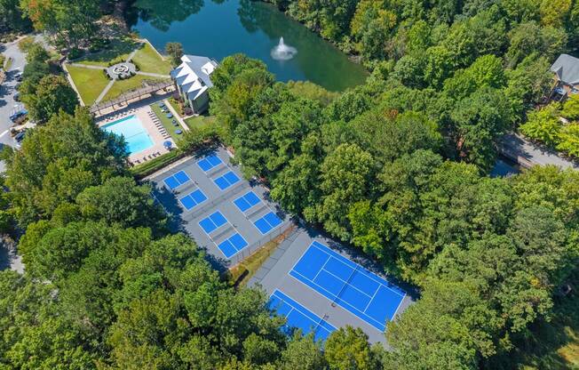 an aerial view of the tennis court and pool at the resort