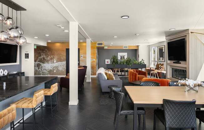 A modern dining room with a long table and chairs.