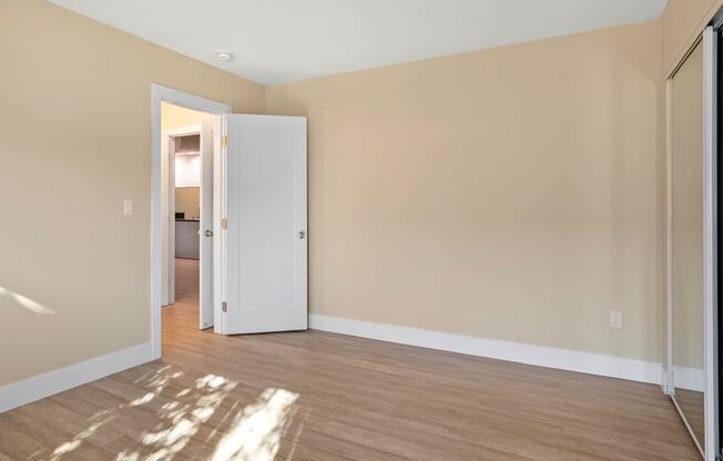 Apartments in Marina Del Rey bedroom with mirrored closet doors.