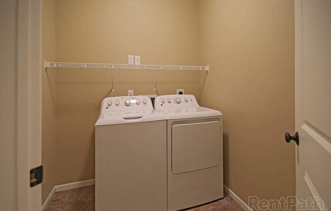 laundry room, washer and dryer  at Cascades of Mandan, North Dakota, 58554